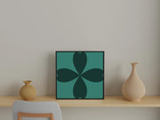 Abstract Cloverleaf Wall Art in a modern frame, displayed on a minimalist shelf with vases