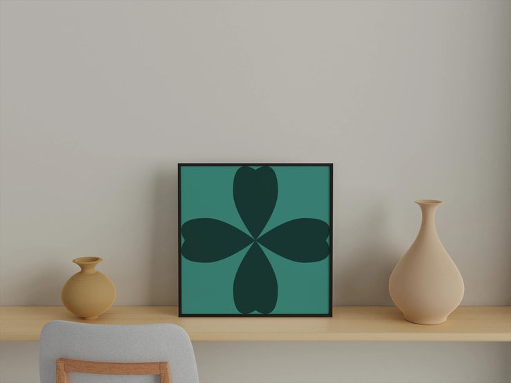 Abstract Cloverleaf Wall Art in a modern frame, displayed on a minimalist shelf with vases