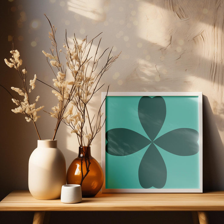 Abstract Cloverleaf Wall Art featuring a teal background and dark green cloverleaf design in a modern frame