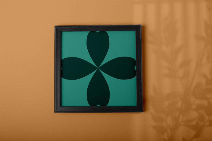 Framed Abstract Cloverleaf Wall Art on a warm-toned wall, featuring a minimalist design
