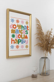 Colorful Retro Do What Makes You Happy Matte Poster Print in a gold frame on a wall with decorative plant