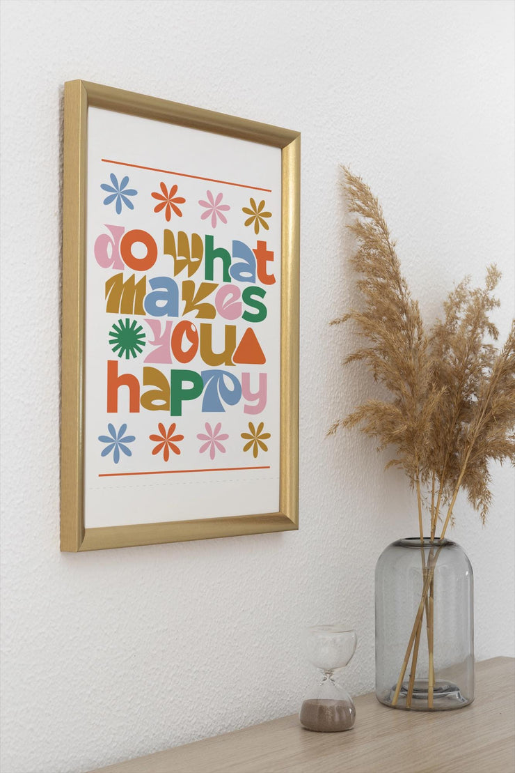Colorful Retro Do What Makes You Happy Matte Poster Print in a gold frame on a wall with decorative plant