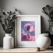 Dreamy Moon and Palm Tree poster framed on a wall with decorative plants