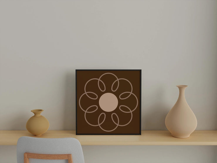 Framed poster featuring an Earthy Circle in Brown design, displayed on a shelf with minimalist decor