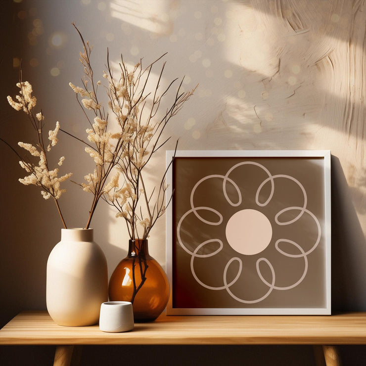 Earthy Circle in Brown framed poster displayed on a wooden table with decorative vases and dried flowers