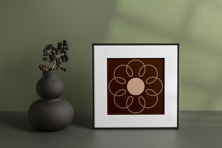 Framed poster of an Earthy Circle in Brown with a floral design against a green background