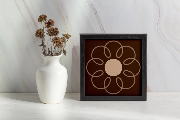 Framed poster featuring an Earthy Circle in Brown design with a floral motif and neutral tones